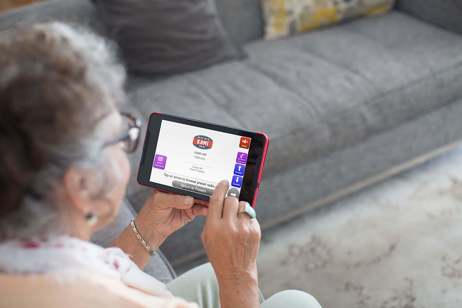 senior enjoying tablet entertainment