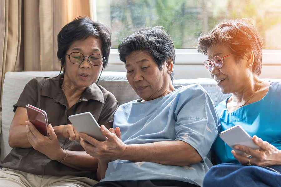 senior using health app on tablet