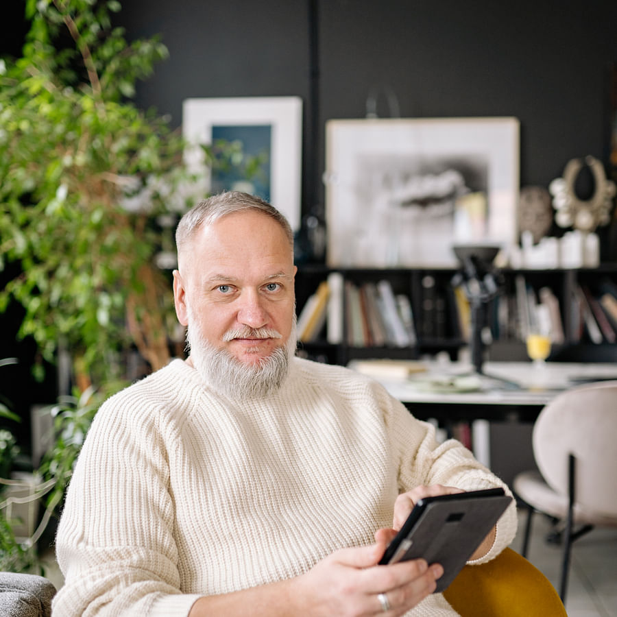 Senior citizen engaging with a gardening app on a tablet