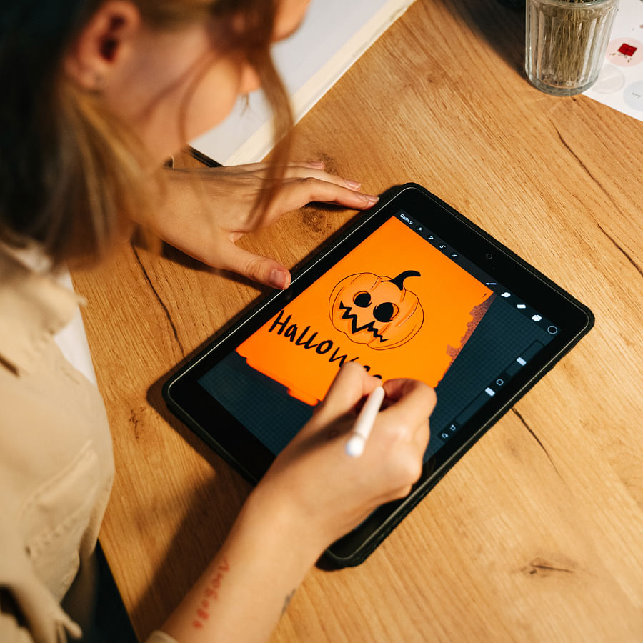 Senior citizen comfortably using a tablet